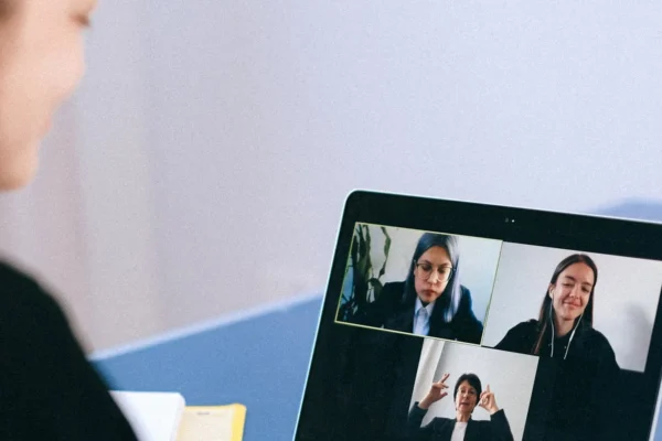 Woman participating in an online community meeting, representing safe moderated digital spaces