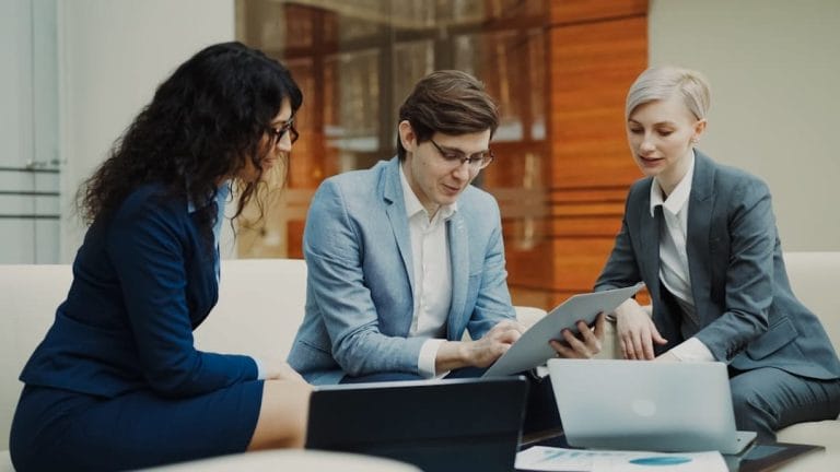 Business team discussing client relationship management strategies in a meeting