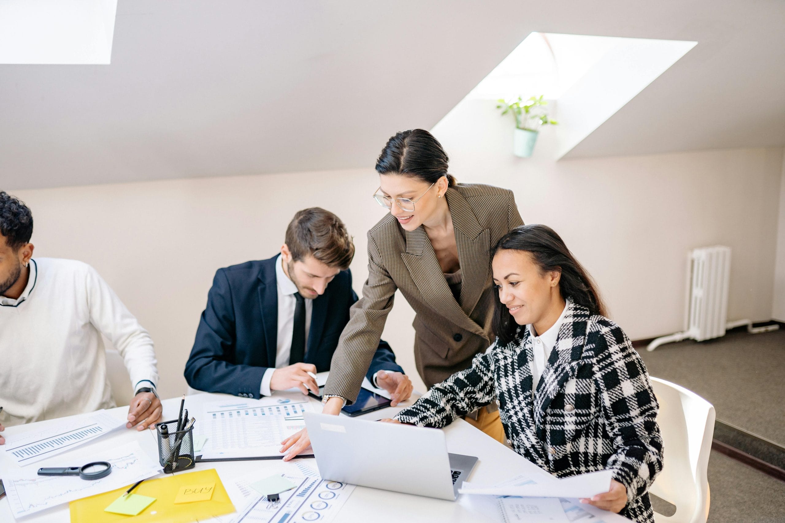 Office team collaborating during a customer support strategy meeting