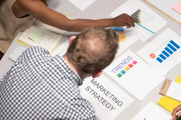 Marketing team analyzing lead tracking data on dashboard