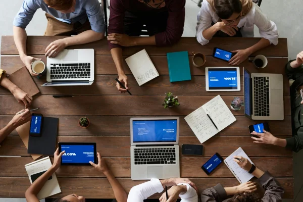 Remote team collaborating on digital files representing encrypted file sharing