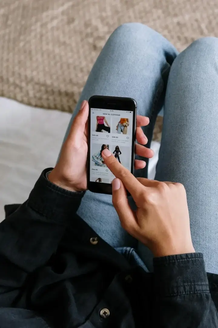 Shopify store owner reviewing an AI chatbot conversation on a laptop
