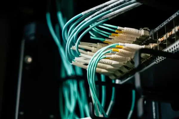 Server racks in a data center with blue indicator lights