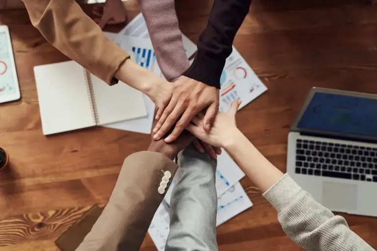 Diverse team members in a collaborative workplace meeting