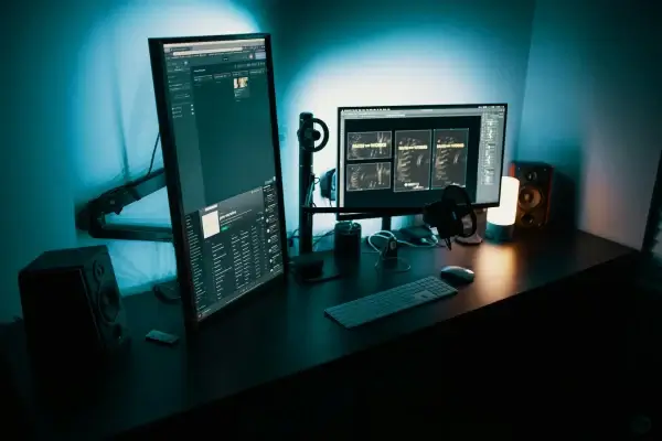Marketer browsing premium stock photo library on a large monitor
