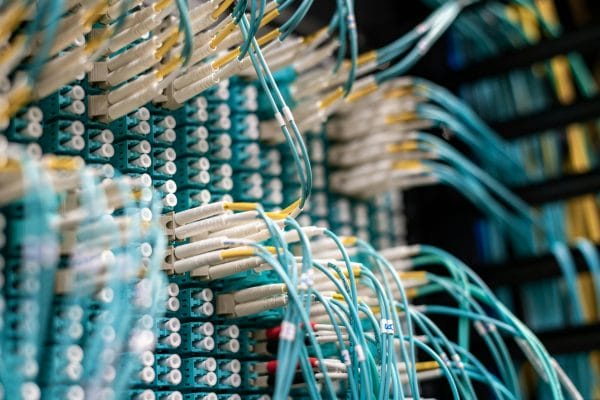Server room network cables representing hosting control panel infrastructure