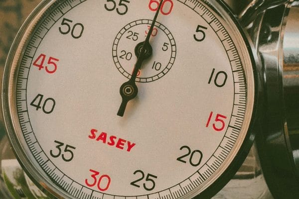 Stopwatch close-up representing free vs paid time tracking software comparison