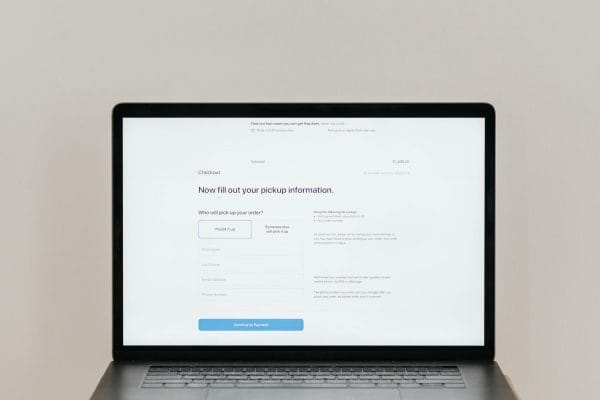 Laptop displaying online form representing WordPress form plugin comparison
