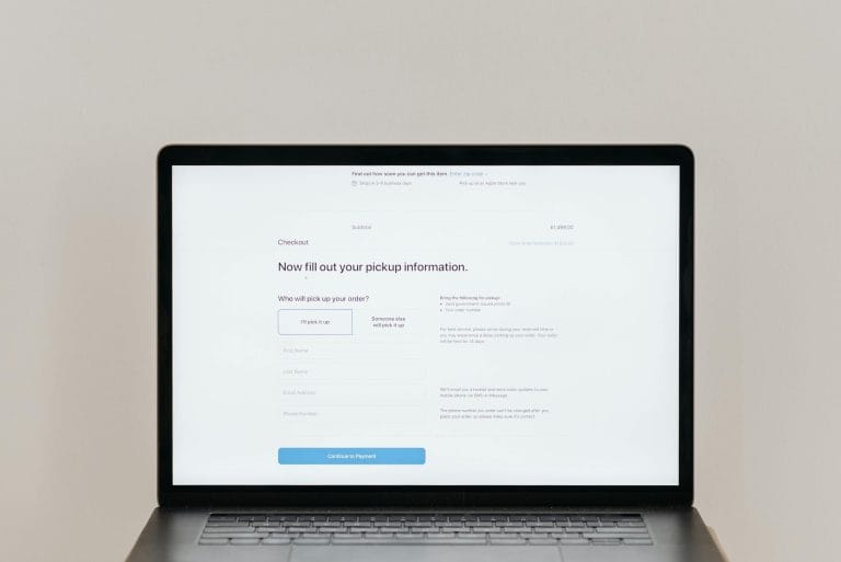 Laptop displaying online form representing WordPress form plugin comparison