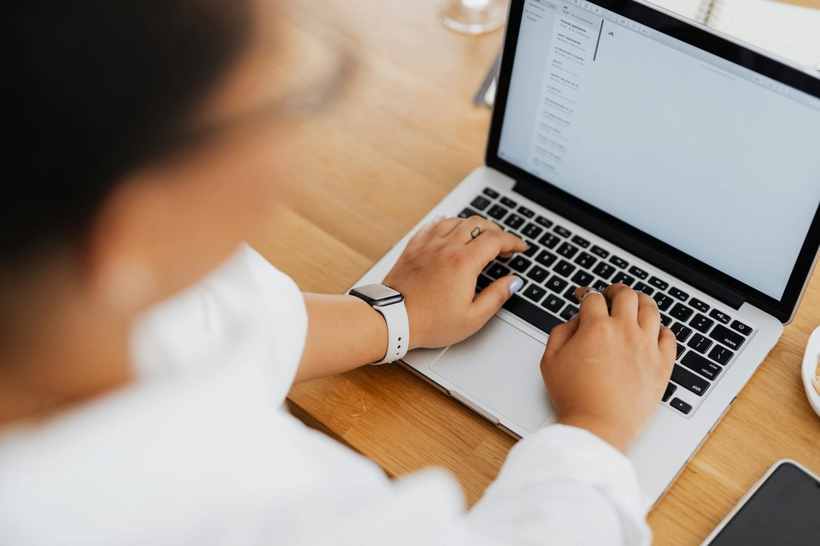 Hands typing on laptop representing cold email outreach platforms comparison