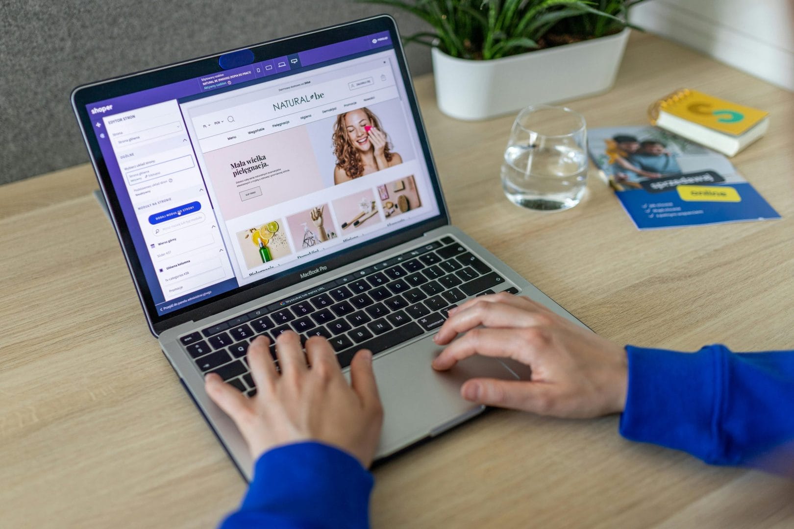 Hands typing on laptop showing ecommerce website representing AI product listing platforms