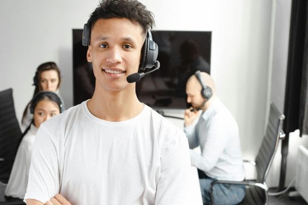 Call center agents with headsets representing AI voice platform comparison