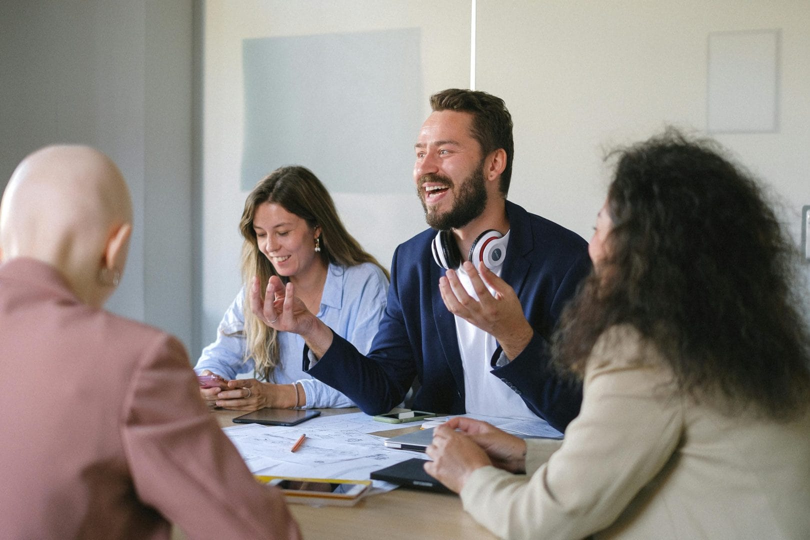 Happy colleagues collaborating in office representing employee engagement platforms