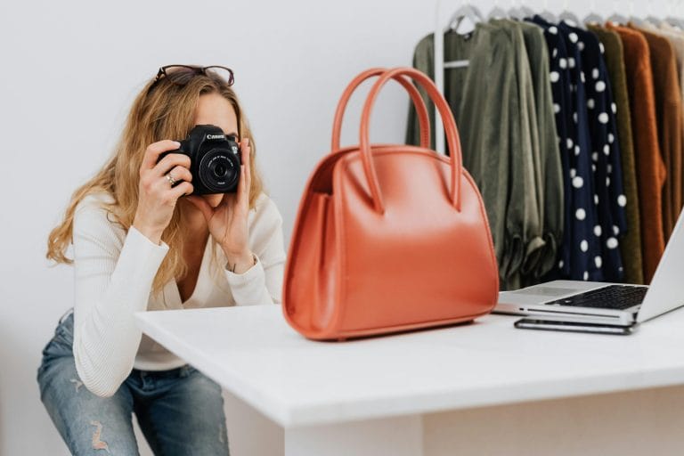 Photographer creating product images representing AI copywriting for ecommerce listings