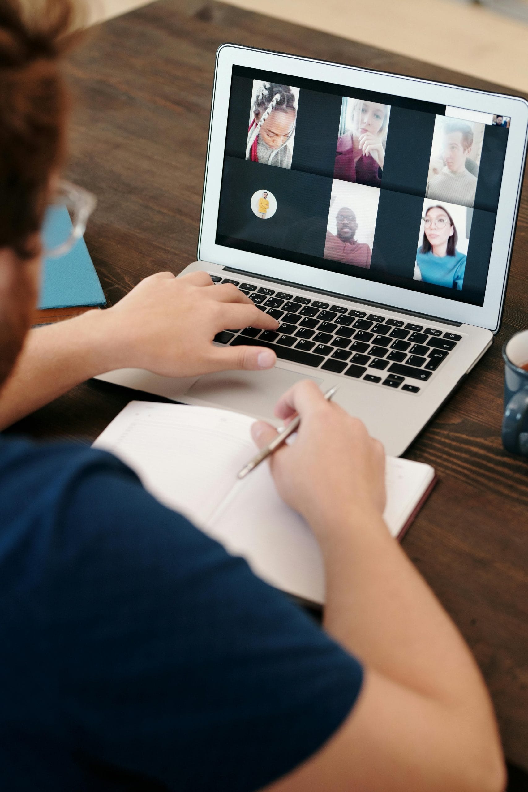Remote team meeting on laptop representing employee monitoring software comparison