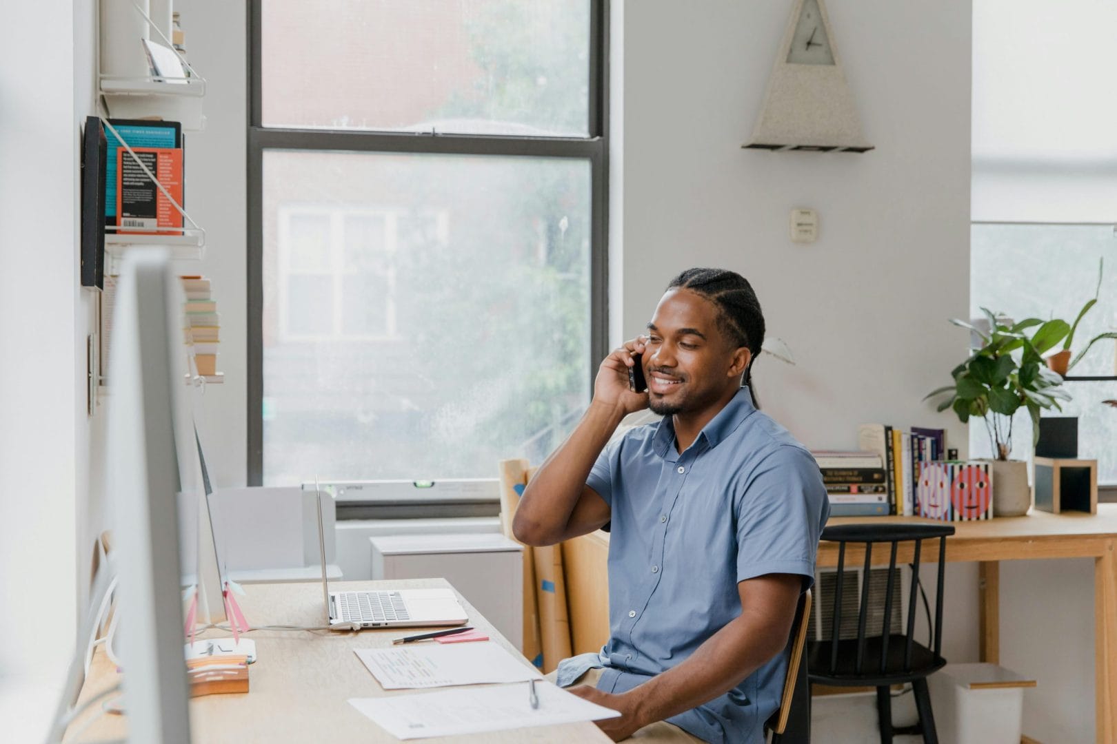 Professional on business phone call representing paid vs free phone service comparison