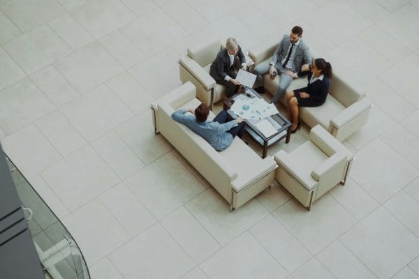 Modern sales team meeting representing sales engagement platform comparison