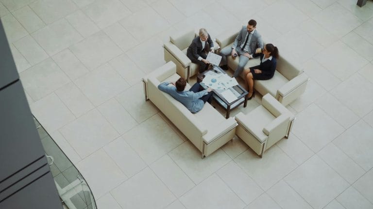 Modern sales team meeting representing sales engagement platform comparison